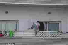 MailOnline reporters in Magaluf watched a clubber dangerously clamber across a balcony after another night of hedonistic excess in the party resort this week