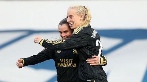 Amalie Vangsgaard hugs Noelle Maritz as both wear Aston Villa's black change kit