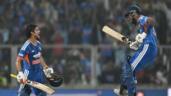 Hardik Pandya, right, celebrates Ishan Kishan's, left, hundred (AFP)