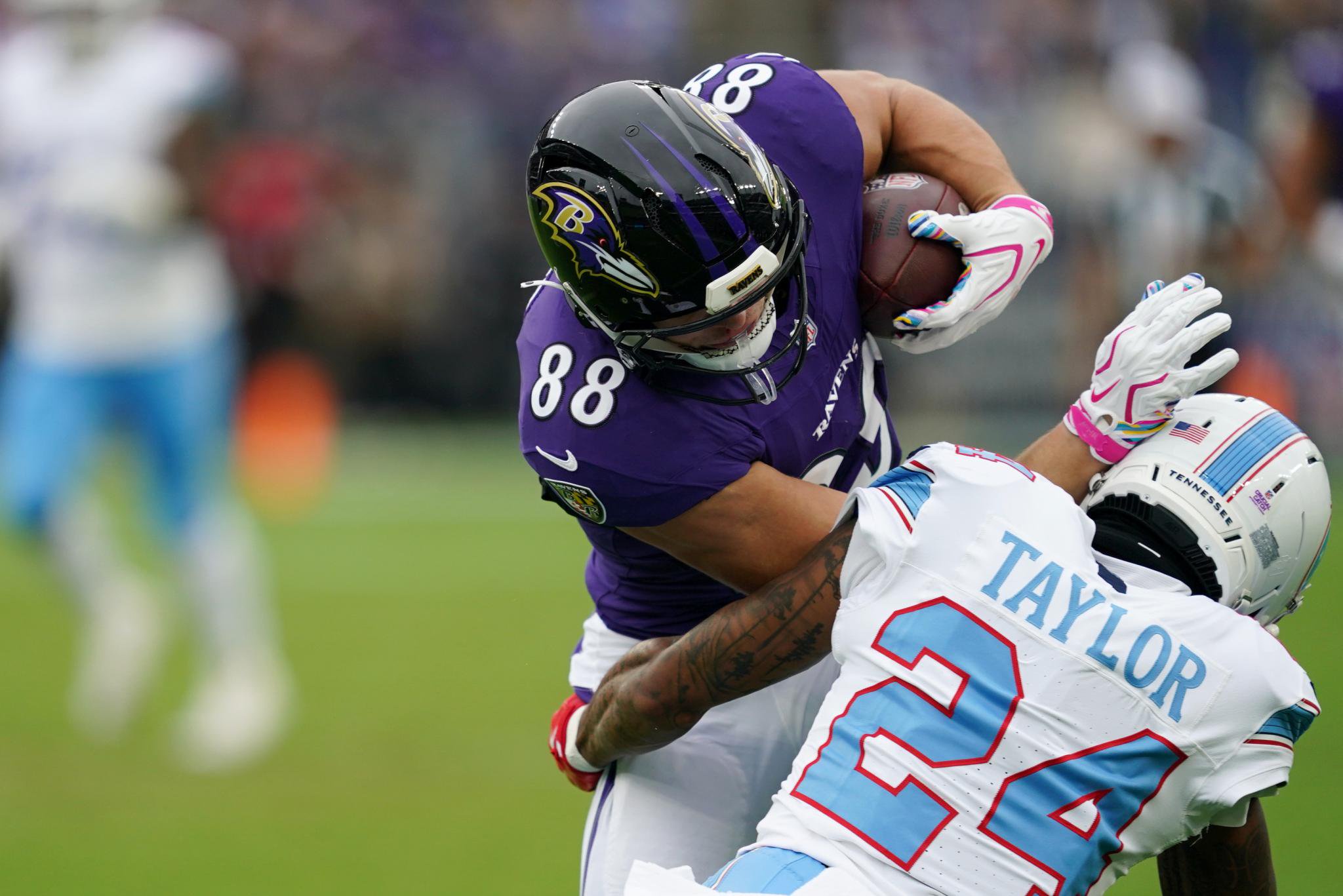 Baltimore Ravens tight end Matt Hibner (88) is tackled by Tennessee Titans cornerback Alontae Taylor (24).