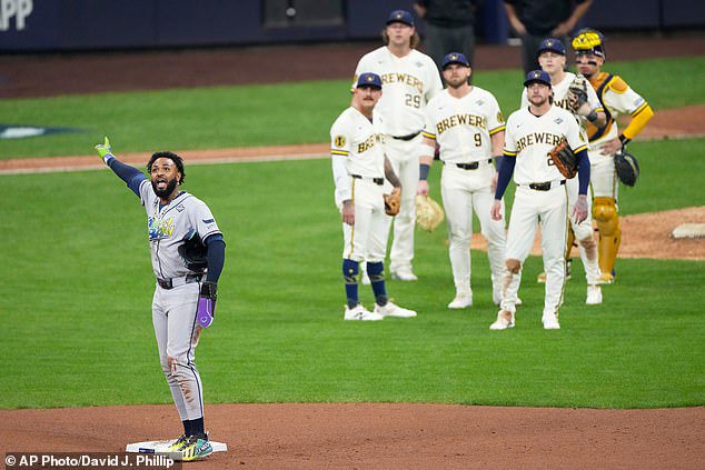 The Rays' Junior Caminero celebrates after umpires overturned a double play in the ninth