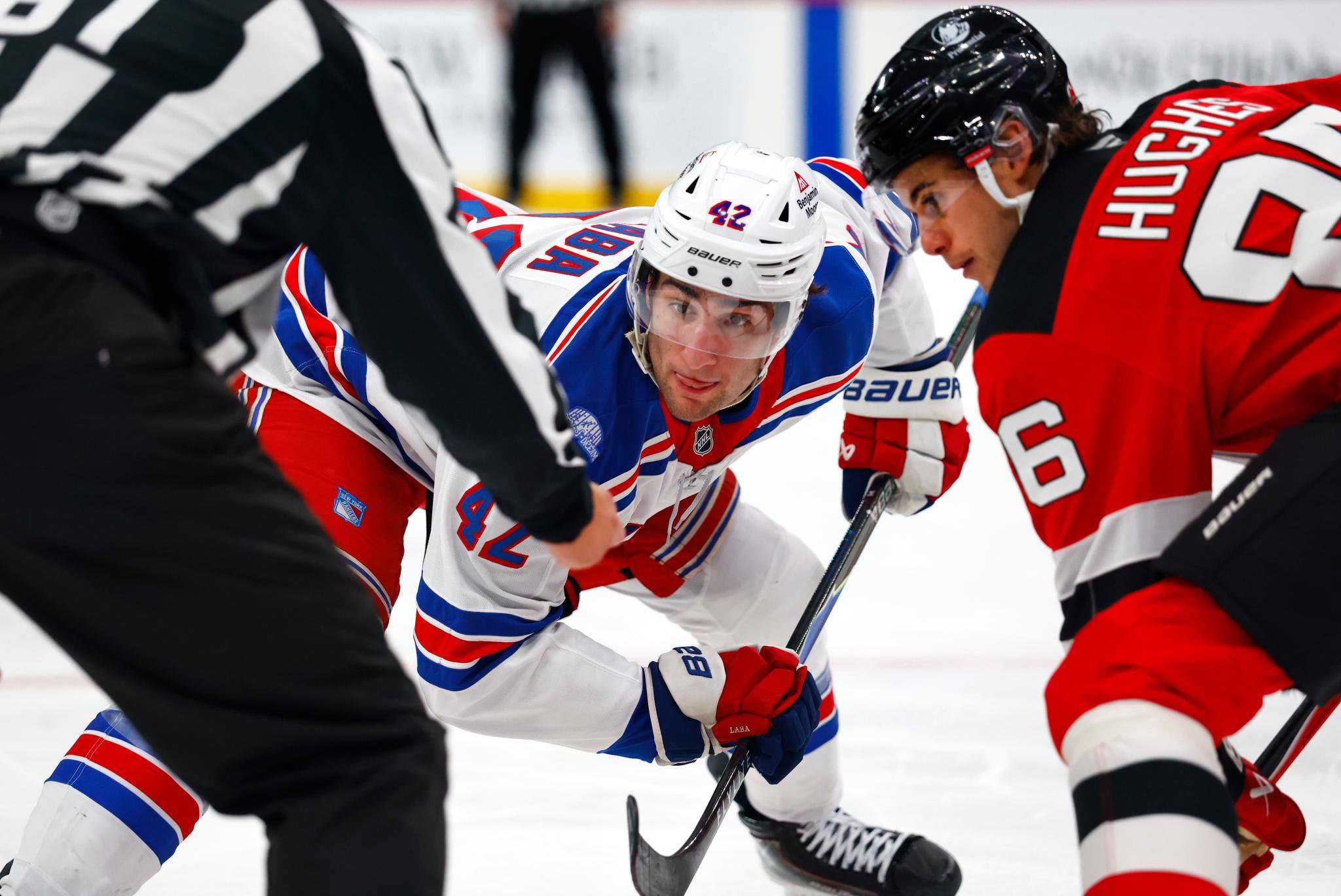 New York Rangers center Noah Laba (42) waits for the puck to drop during a faces off with New Jersey Devils center Jack Hughes (86) during the second period of an NHL hockey game, Thursday, Oct.15, 2026, in Newark, New Jersey. 