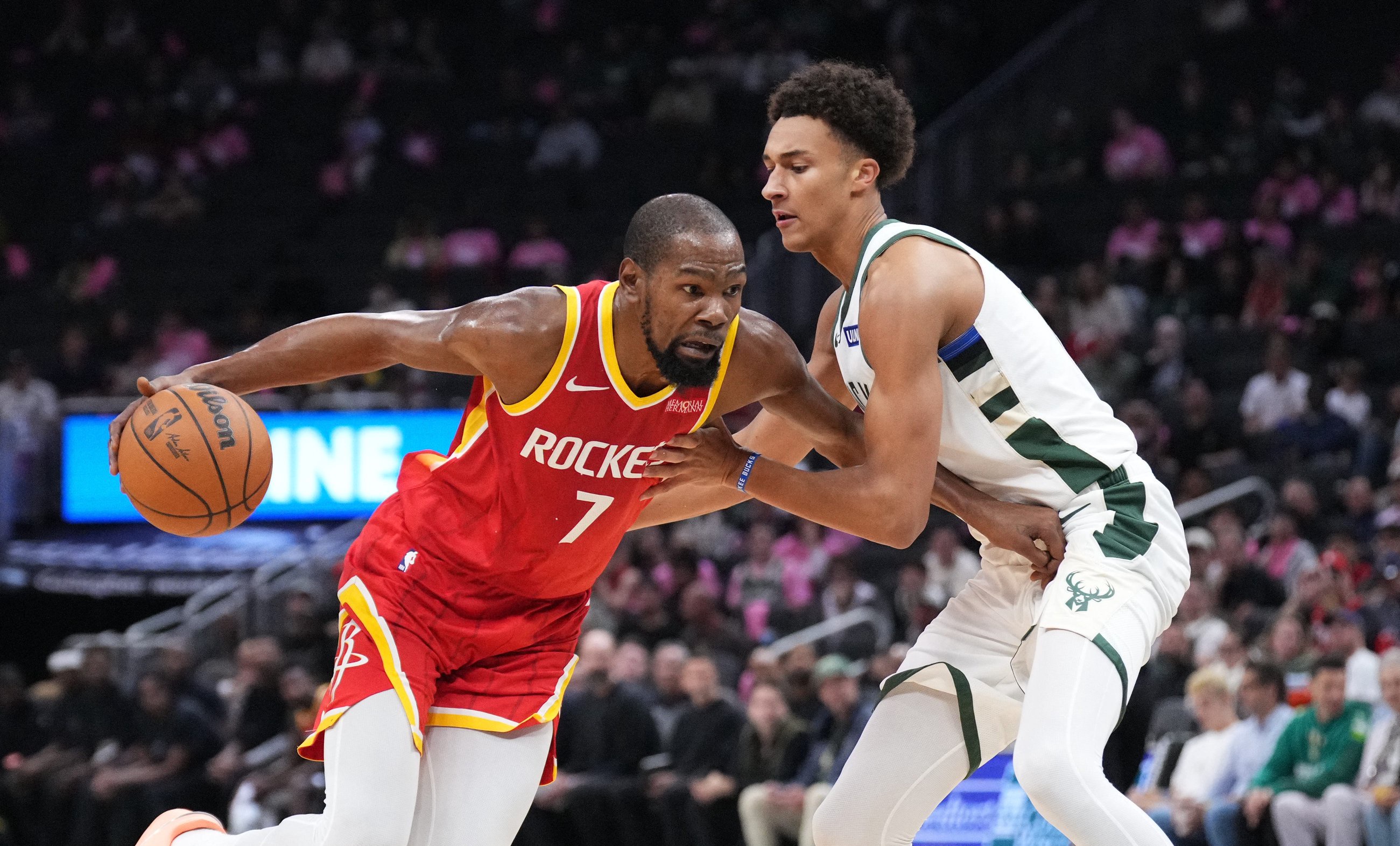 Oct. 28, 2026; Milwaukee, Wisconsin; Houston Rockets forward Kevin Durant (7) drives against Milwaukee Bucks forward Nate Ament (15) in the first half at Fiserv Forum.