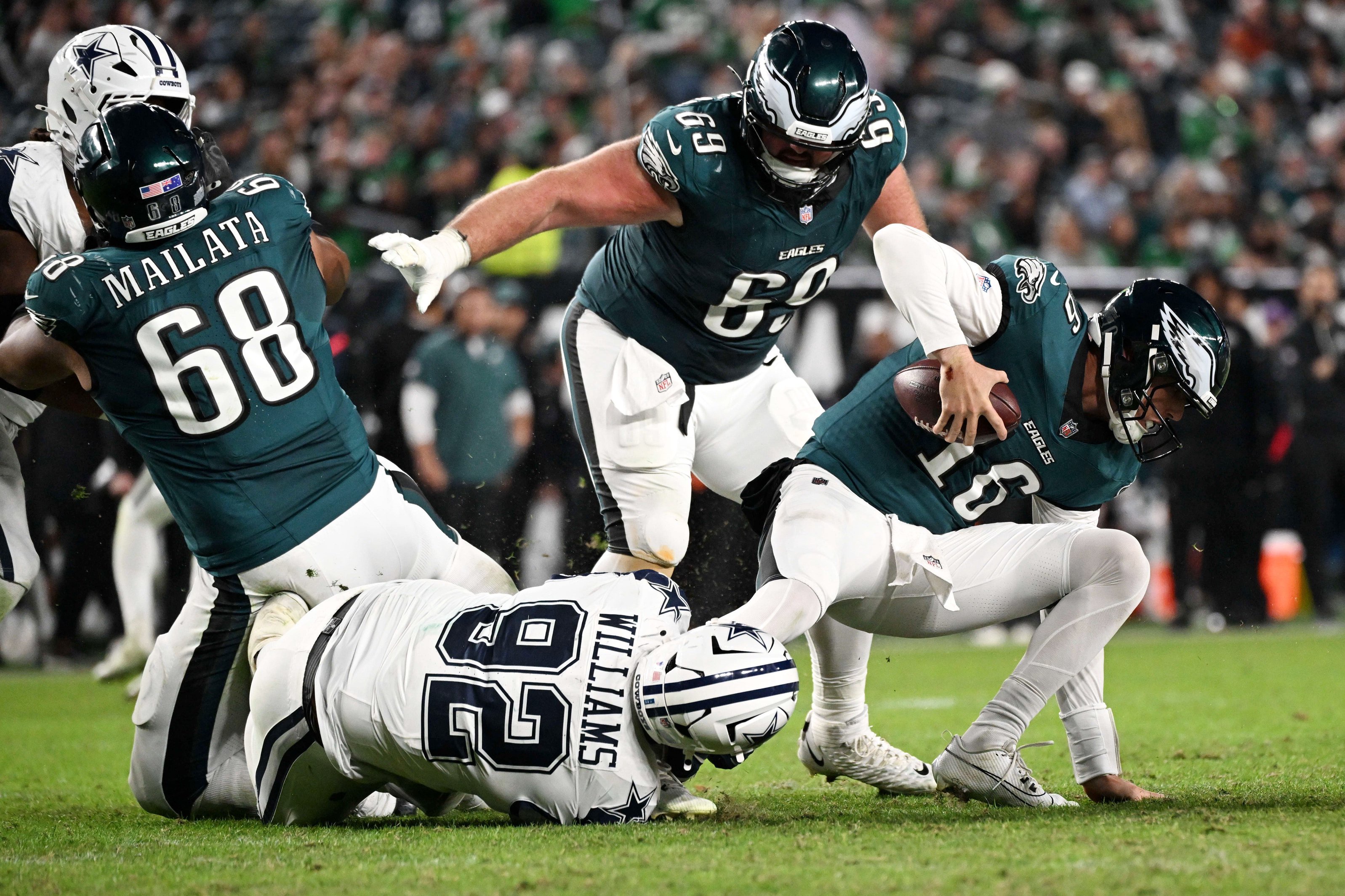 Oct 26, 2026; Philadelphia, Pennsylvania, USA;  Philadelphia Eagles quarterback Tanner McKee (16) is sacked by Dallas Cowboys defensive tackle Quinnen Williams (92) during the fourth quarter at Lincoln Financial Field.  Mandatory Credit: Eric Hartline-Imagn Images