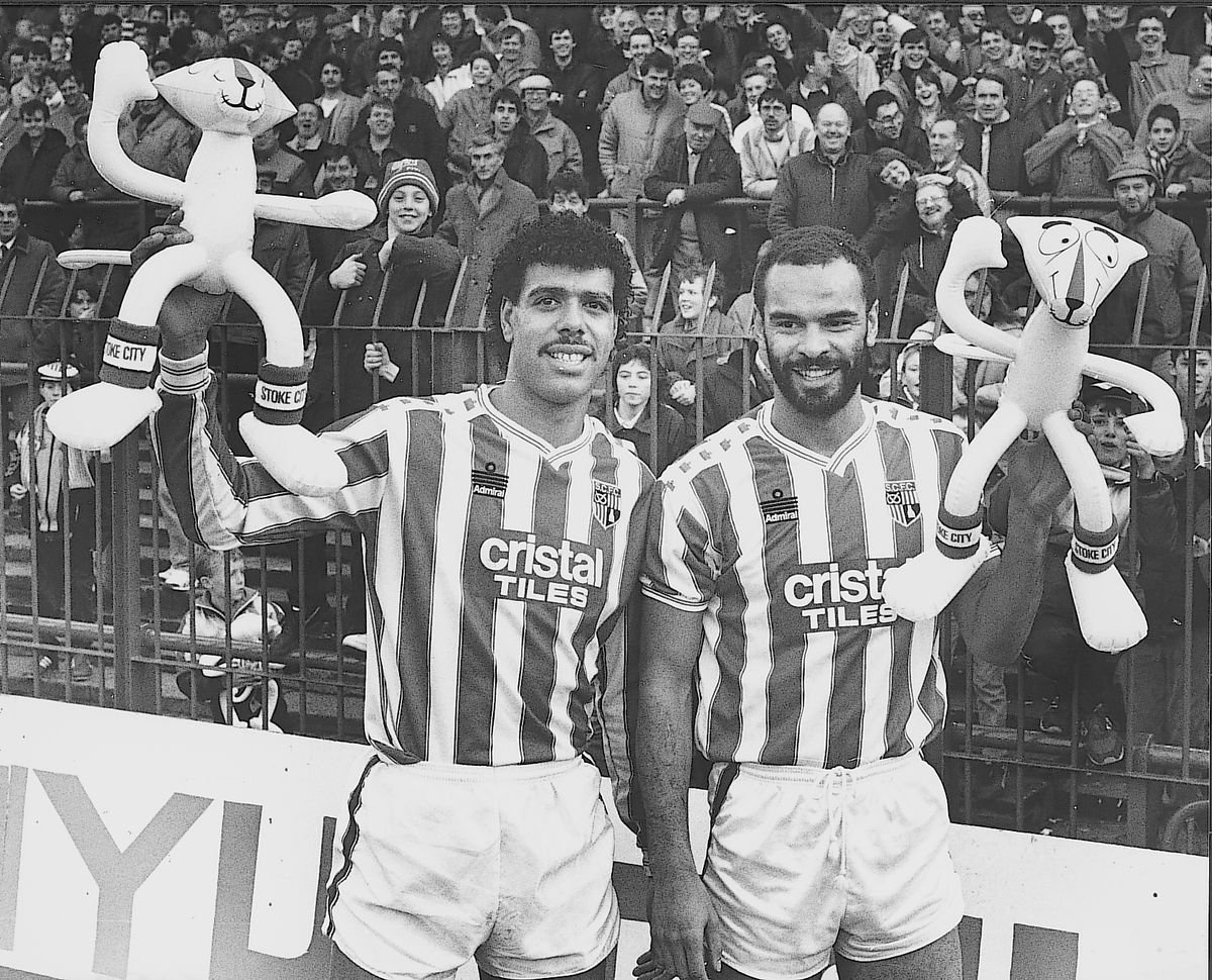 Chris Kamara and George Berry wave pink panthers during an inflatable craze at Stoke City in the 1980s.