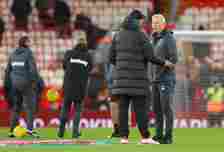 Jurgen Klopp the manager of Liverpool talks with David Moyes the manager of West Ham United prior to the Carabao Cup Quarter Final match between Li...