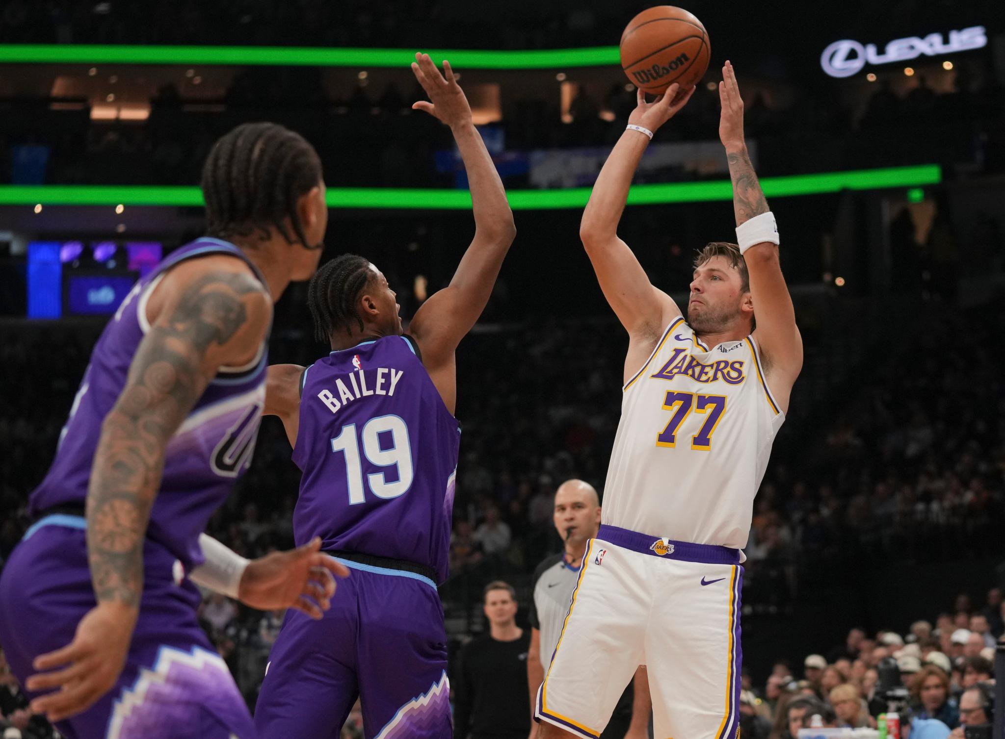 Los Angeles Lakers forward/guard Luka Dončić (77) shoots over Utah Jazz forward Ace Bailey (19).