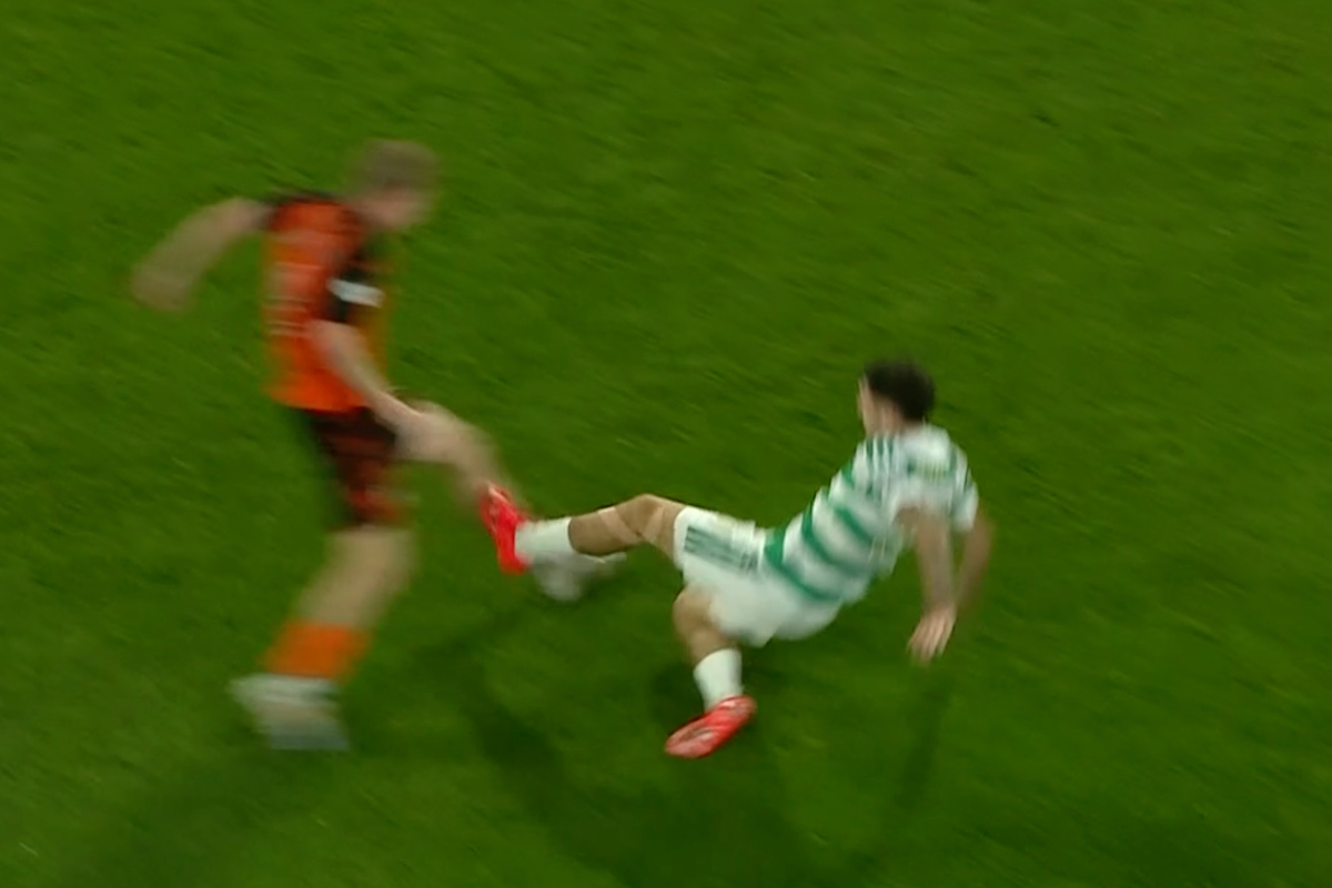 Celtic's Colby Donovan is booked vs Dundee United