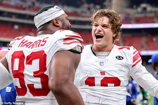 Giants head coach John Harbaugh gave McCarthy (right) the honorary game ball after the win