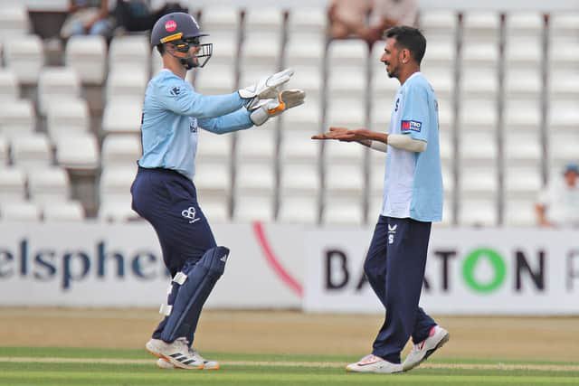 Yuzi Chahal celebrates claiming a wicket with Lewis McManus (Picture: Peter Short)