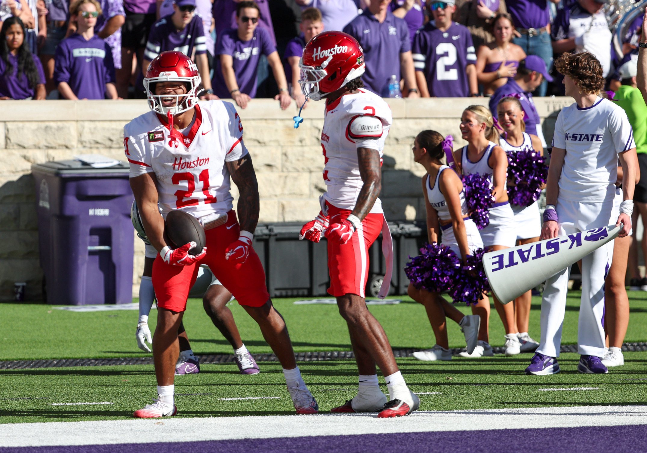 Oct 10, 2026; Manhattan, Kansas, USA;  Houston Cougars running back Makhi Hughes (21) celebrates a touchdown with wide receiver Koby Young (2) during the second quarter against the Kansas State Wildcats at Bill Snyder Family Football Stadium.  Mandatory Credit: Scott Sewell-Imagn Images