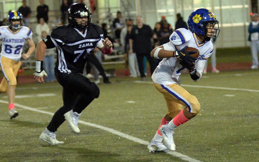 Jaydn Hooker looks for room to run.