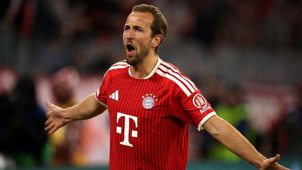 Bayern Munich forward Harry Kane celebrates scoring against Arsenal 