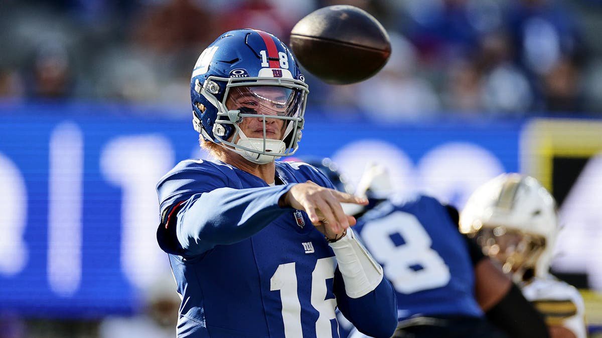 J.J. McCarthy throws during an NFL game against the Saints.