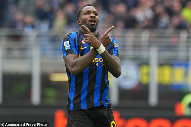 Inter Milan's Marcus Thuram celebrates scoring his side's opening goal during the Serie A soccer match between Inter Milan and Fiorentina, in Milan, Italy, Sunday, Oct. 25, 2026. (AP Photo/Antonio Calanni)