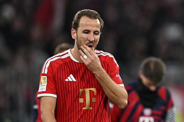 Munich's Harry Kane reacts after the German Bundesliga soccer match between FC Bayern Munich and Borussia Dortmund in Munich, Germany, Saturday, Oct. 31, 2026. (Sven Hoppe/dpa via AP)