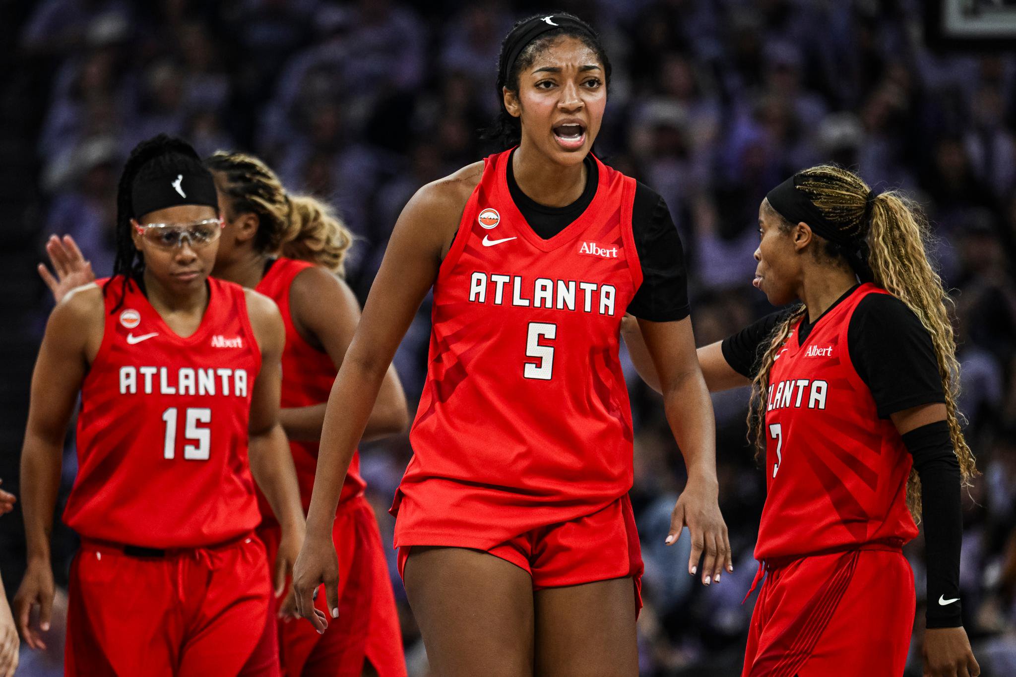 Basketball player Angel Reese on the court during a game.
