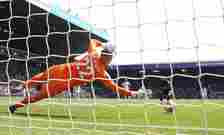 Callum Wilson of Newcastle United scores the team's first goal from the penalty spot past Joel Robles of Leeds United during the Premier League mat...