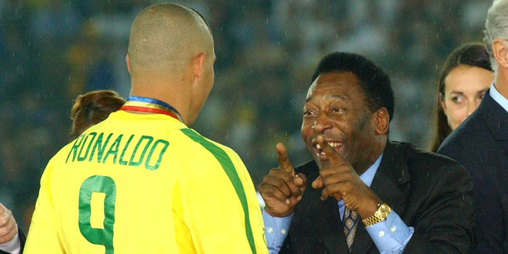 Pele celebrates with Ronaldo after Brazil's World Cup triumph in 2002.