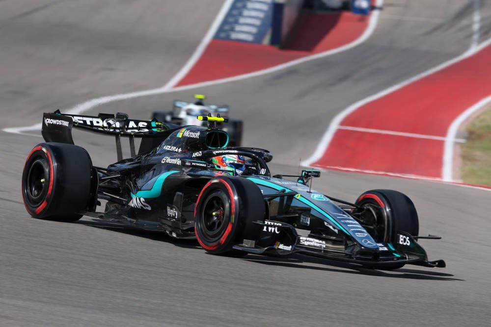 Kimi Antonelli in his Mercedes F1 car at the Austin Grand Prix circuit, with a rival car behind on the track