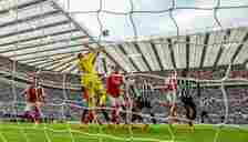 Arsenal's Aaron Ramsdale makes a save during the Premier League match between Newcastle United and Arsenal FC at St. James Park on May 7, 2023 in N...