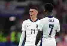 Phil Foden of England tals with Bukayo Saka during the UEFA EURO 2024 group stage match between Serbia and England at Arena AufSchalke on June 16, ...