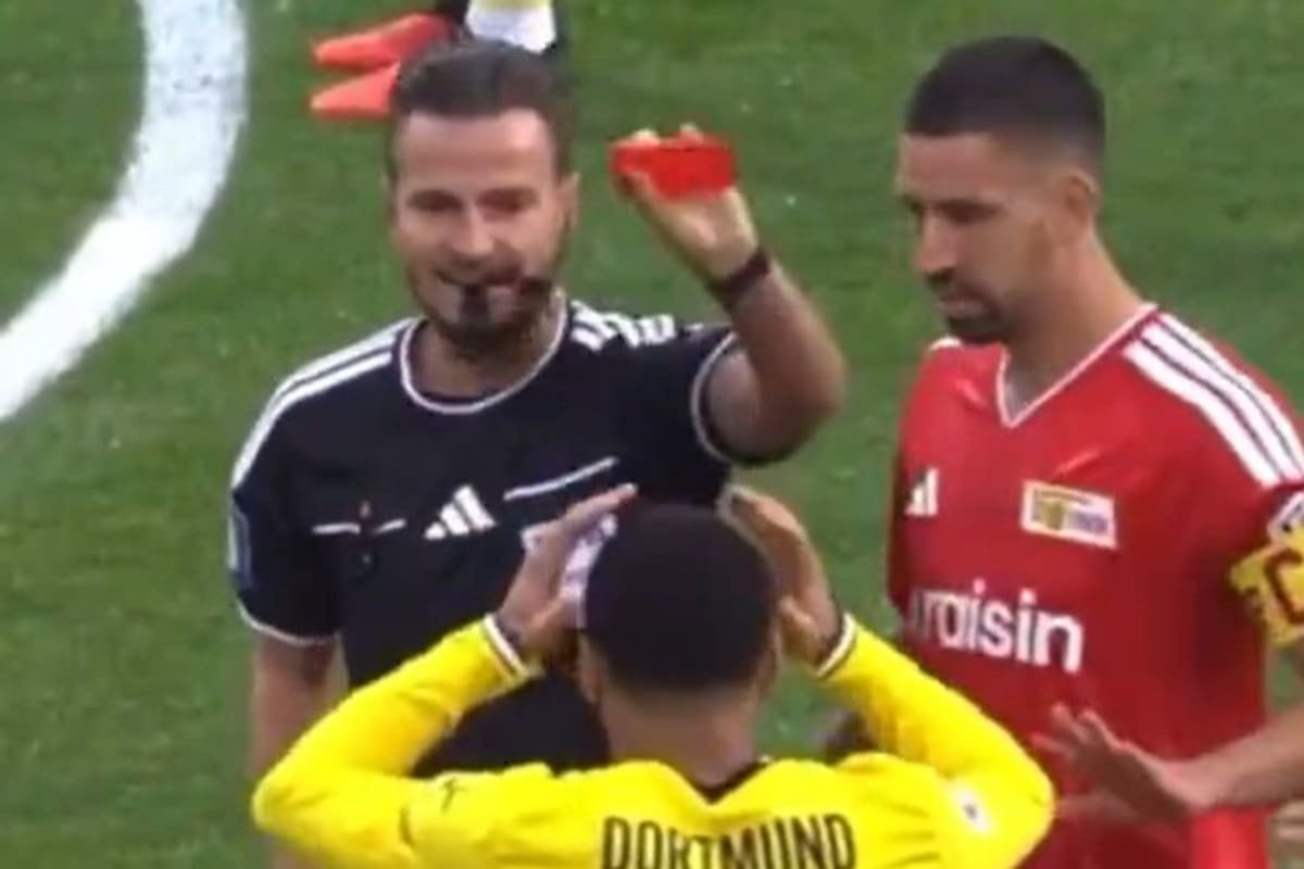 Ethan Nwaneri can't believe as he is shown a red card inside the first minute