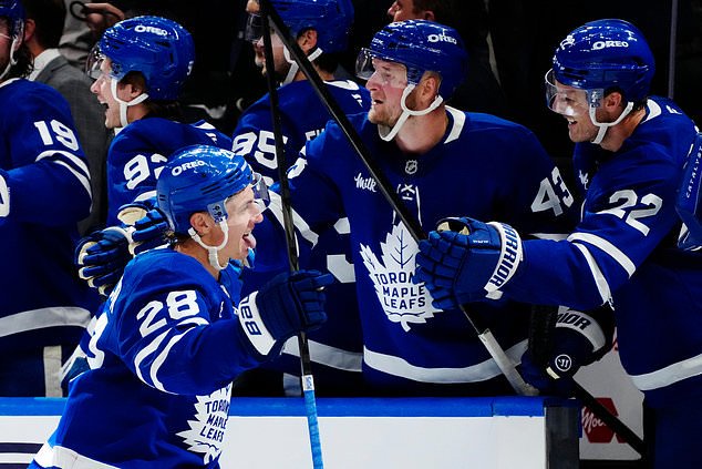 Toronto Maple Leafs' Troy Stecher (28) celebrates after his goal against the New York Rangers during the third period of an NHL hockey game in Toronto, Thursday, Oct. 22, 2026. (Frank Gunn/The Canadian Press via AP)