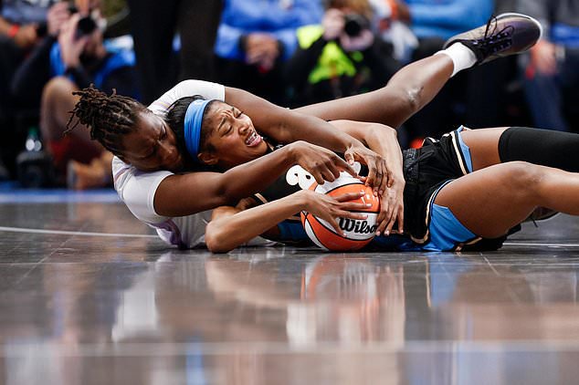 Golden State Valkyries center Aminata Gueye, left, and Atlanta Dream forward Angel Reese (5) compete for possession of the ball during the second half of Game 3 of the WNBA basketball finals on Wednesday, Oct. 21, 2026, in Atlanta. (Santiago Mejia/San Francisco Chronicle via AP)