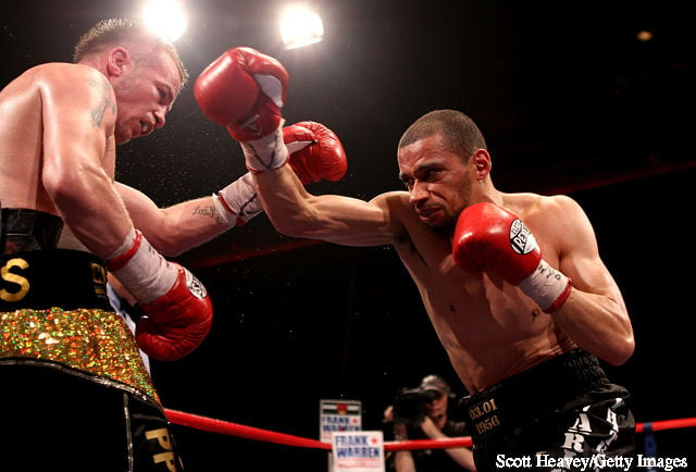 Frankie Gavin (L) is caught by Curtis Woodhouse during the WBO Intercontinental Welterweight Championship bout bout at Echo Arena on July 16, 2011 in Liverpool, England.