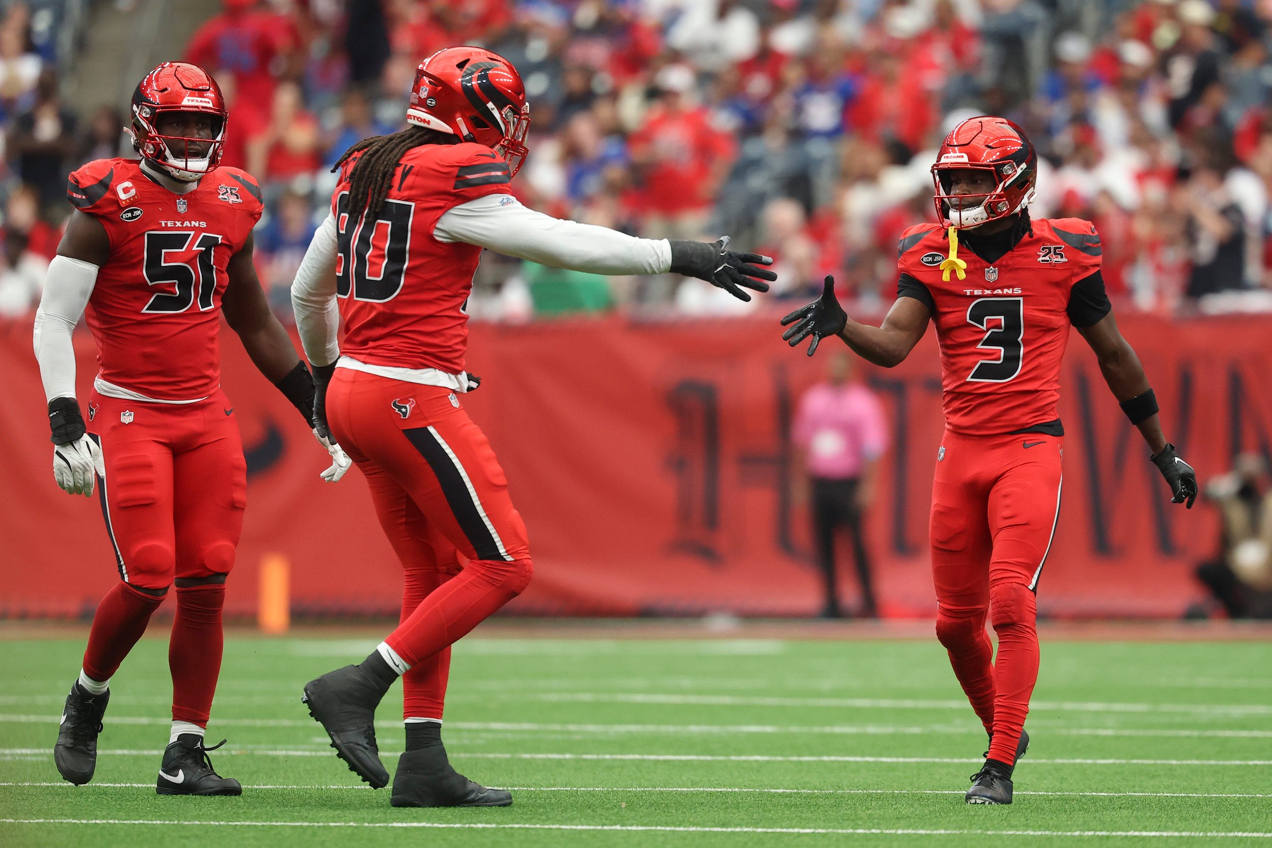 Oct 25, 2026; Houston, Texas, USA; Houston Texans cornerback Kamari Lassiter (3) celebrates with defensive end Jadeveon Clowney (90) after a sack during the third quarter against the New York Giants at Reliant Stadium. Mandatory Credit: Troy Taormina-Imagn Images
