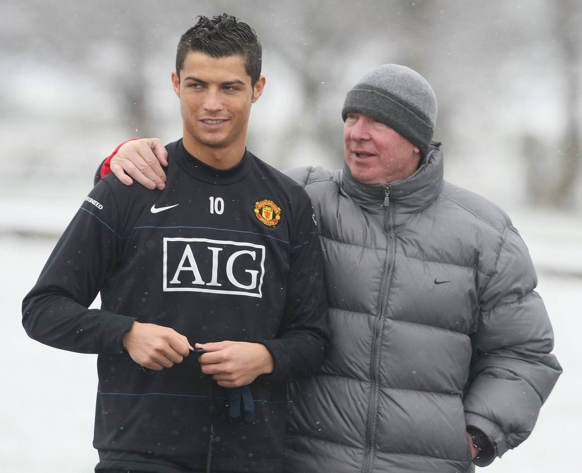 Cristiano Ronaldo and Sir Alex Ferguson of Manchester United in action during a first team training session at Carrington Training Ground in 2009.