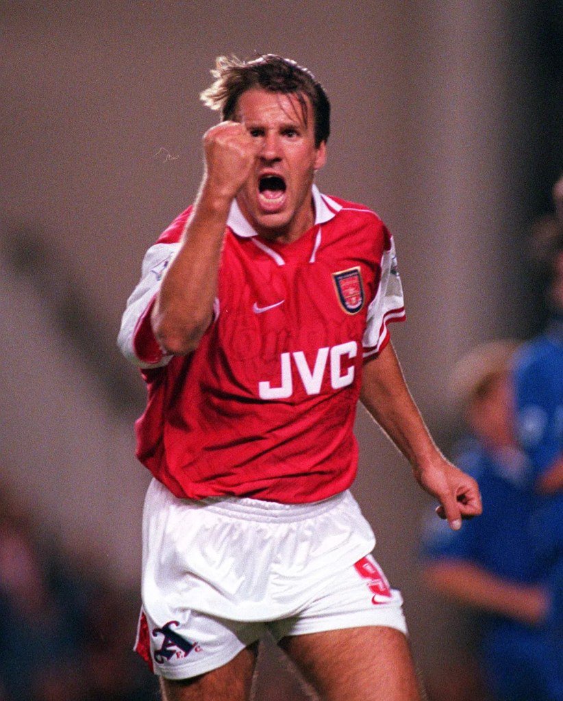 Paul Merson celebrates scoring a goal for Arsenal.