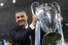Khaldoon Al Mubarak Manchester City Chairman poses with the trophy following the 1-0 victory in the UEFA Champions League 2022/23 final match betwe...