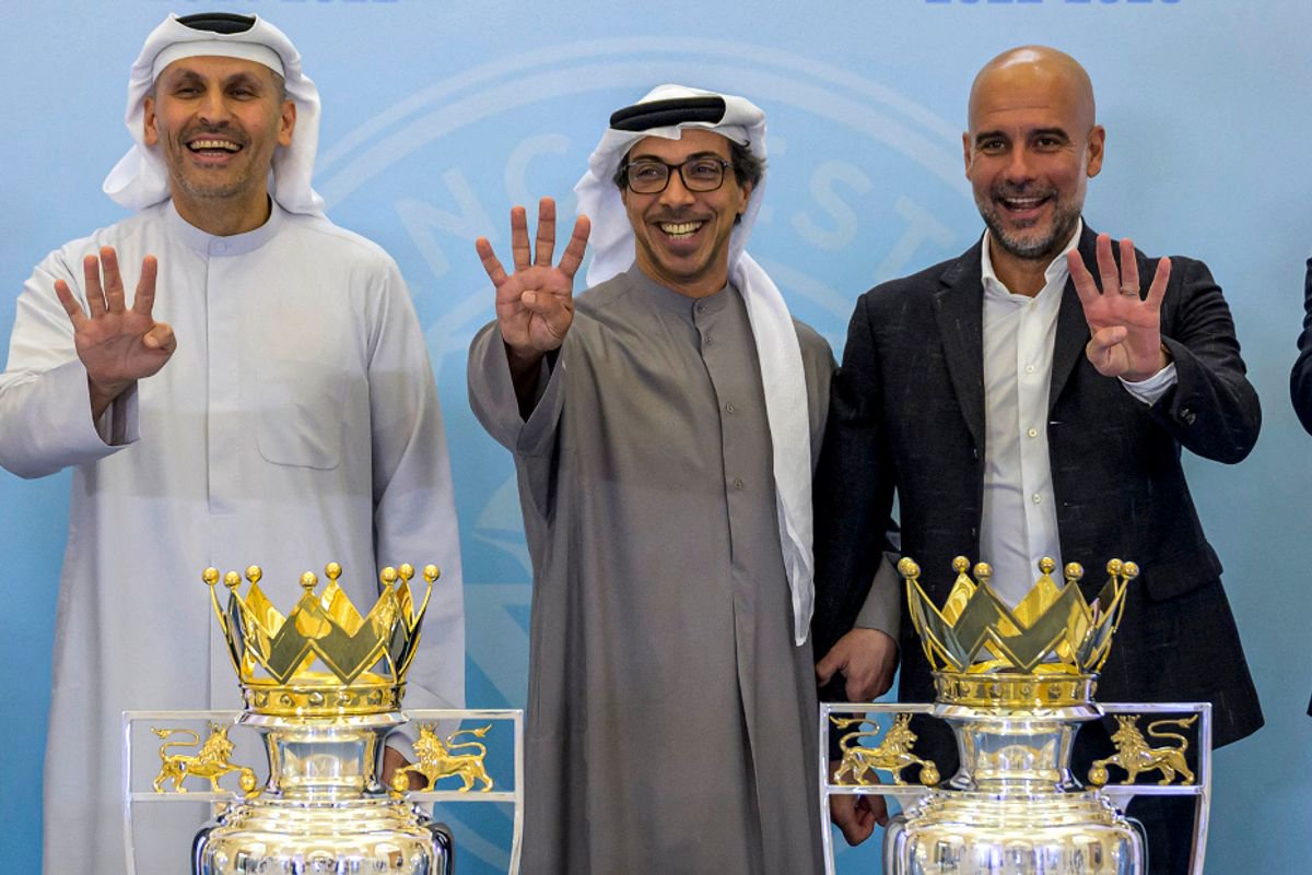 Manchester City owner Sheikh Mansour bin Zayed al-Nahyan (centre) celebrating club's fourth consecutive Premier League title with chairman Khaldoon Al Mubarak (left) and ex-boss Pep Guardiola (right)