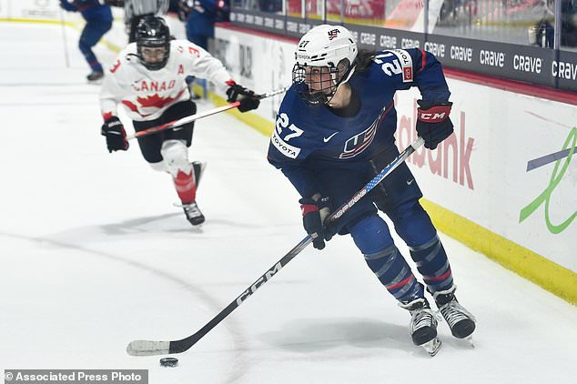 FILE - United States forward Taylor Heise (27) skates with the puck during the second period in the final against Canada at the IIHF Women's World Hockey Championships in Utica, N.Y., April 14, 2024. (AP Photo/Adrian Kraus, File)