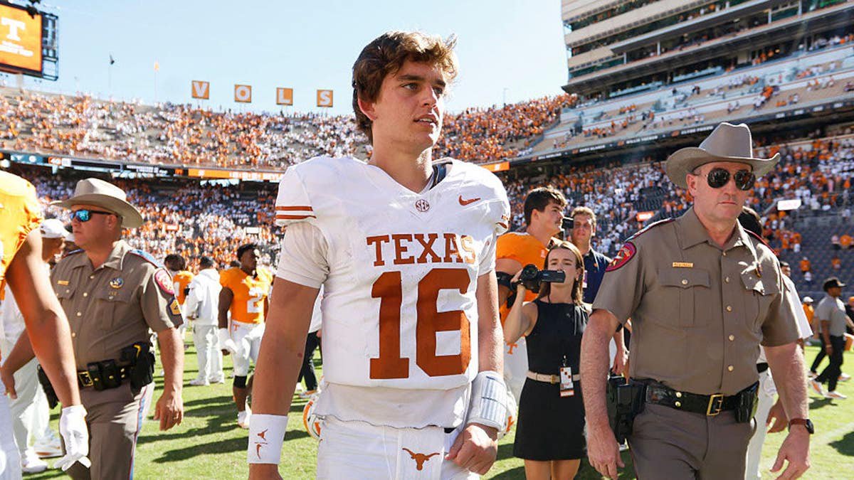 Arch Manning reacts after Texas beats Tennessee at Neyland Stadium.