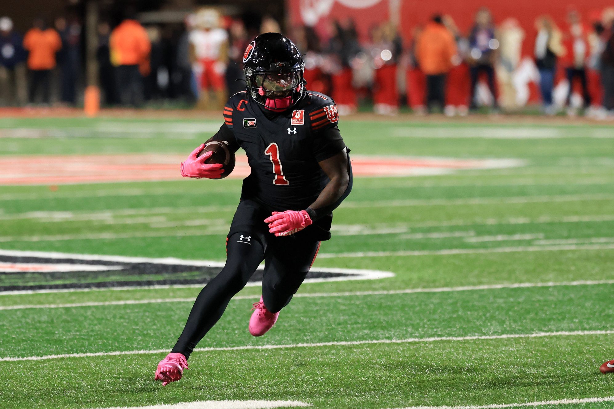 Oct 24, 2026; Salt Lake City, Utah, USA;  Utah Utes running back Wayshawn Parker (1) rushes during the fourth quarter against the Houston Cougars at Rice-Eccles Stadium.  Mandatory Credit: Rob Gray-Imagn Images
