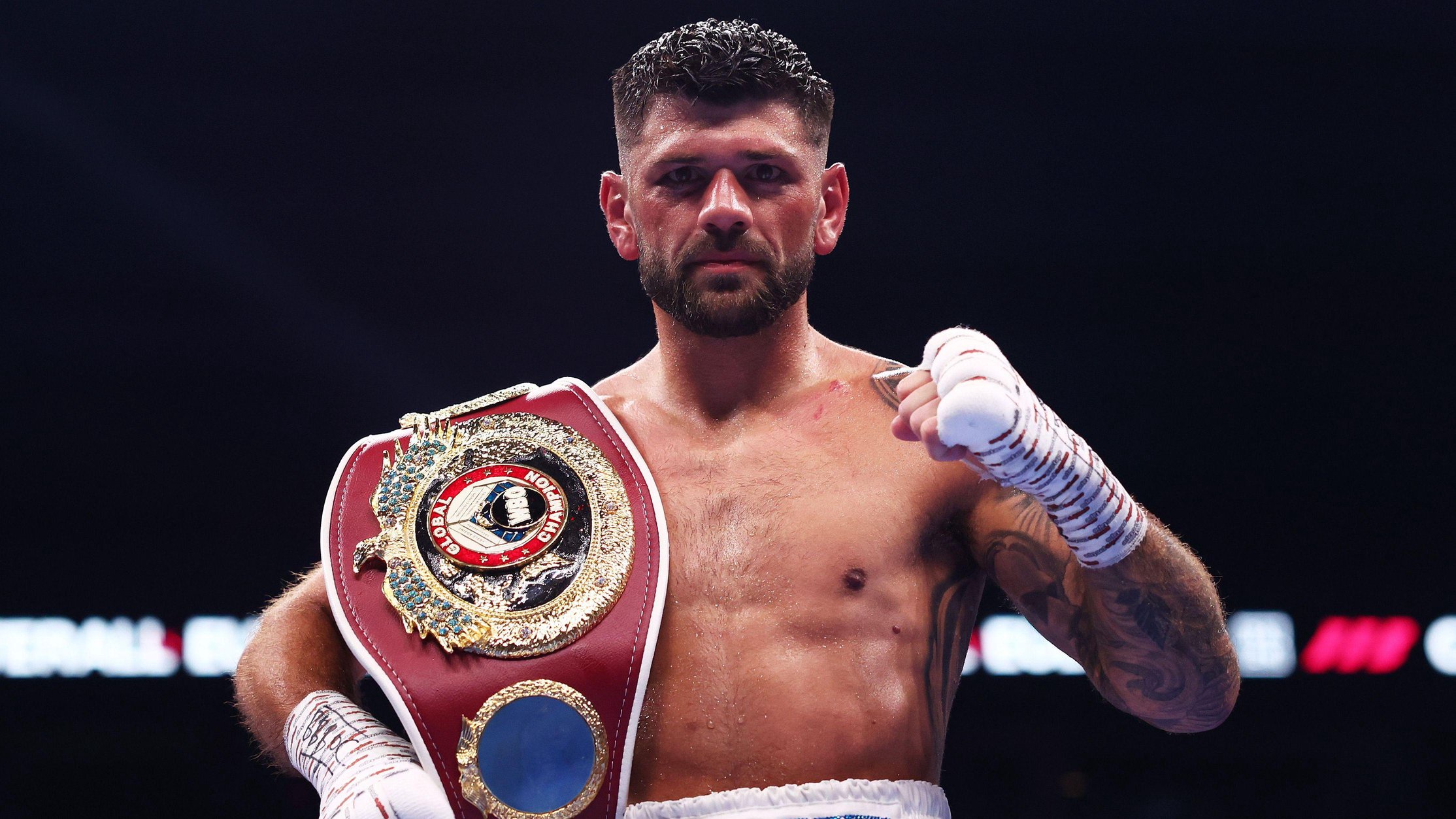 Joe Cordina celebrates with world title belt