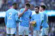 Kyle Walker, Ruben Dias, Bernardo Silva and Julian Alvarez of Manchester City interact during the Premier League match between Manchester City and ...