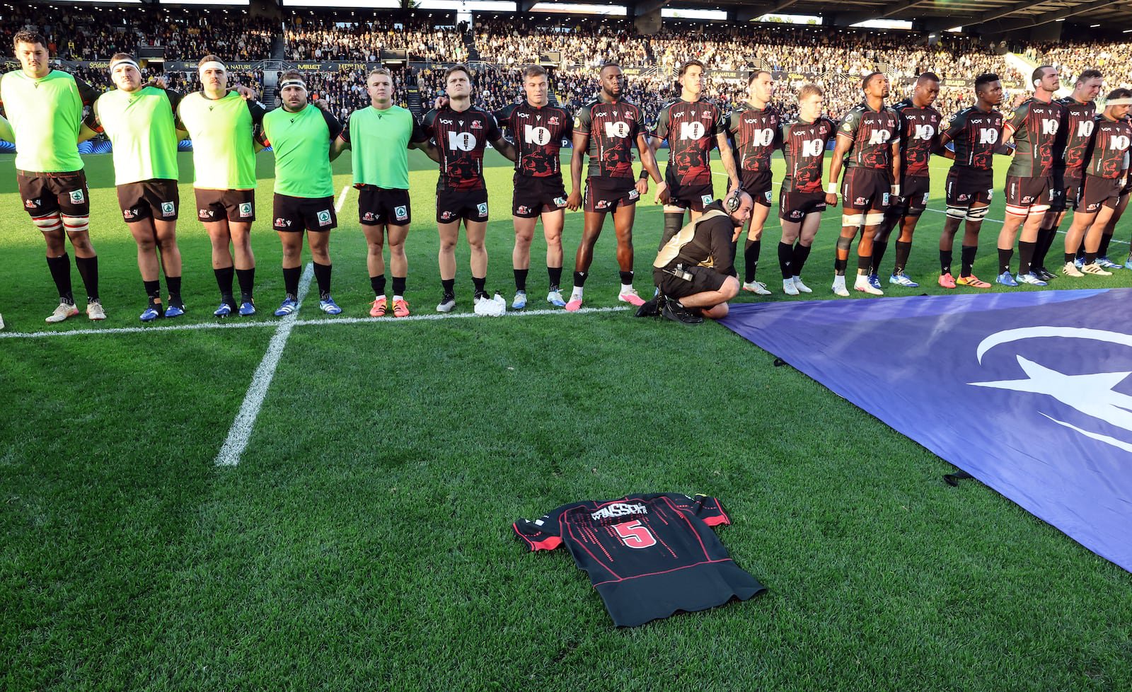 Hyron Diego Andrews’s jersey is laid out in front of the Lions players during the minute of silence ahead of the game against La Rochelle. Photograph: Manuel Blondeau/Inpho