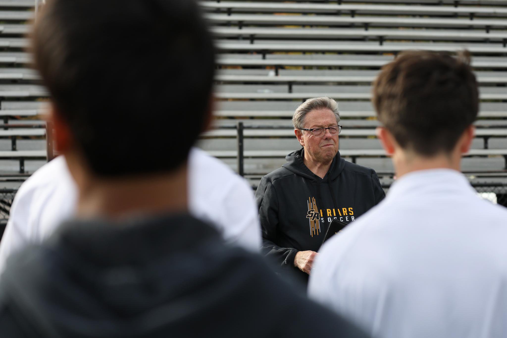 St. Anthony's boys soccer head coach Don Corrao speaks to his players during practice.