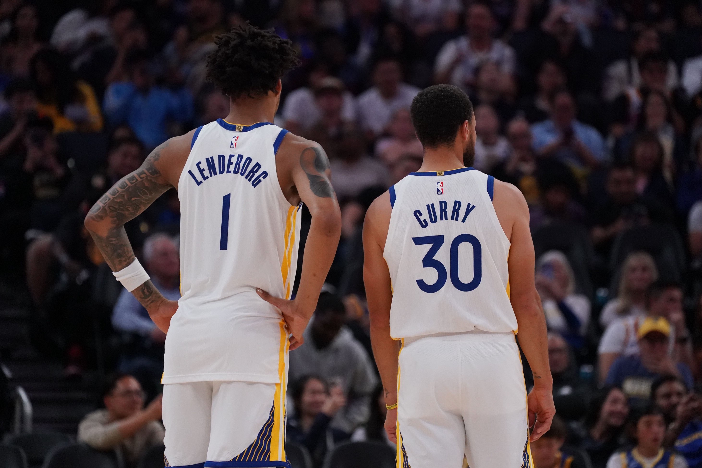 Oct 16, 2026; San Francisco, California, USA;  Golden State Warriors forward Yaxel Lendeborg (1) stands with guard Stephen Curry (30) during a break in the action against the Portland Trail Blazers in the second quarter at Chase Center. Mandatory Credit: David Gonzales-Imagn Images