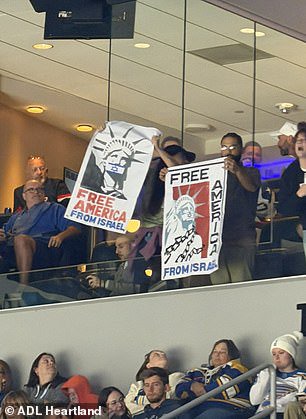 Another of the signs read: 'Free America from Israel'