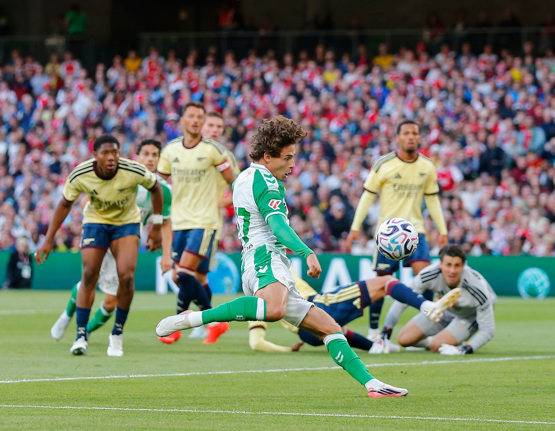 Rodrigo Riquelme of Real Betis scoring the opening goal against Arsenal.
