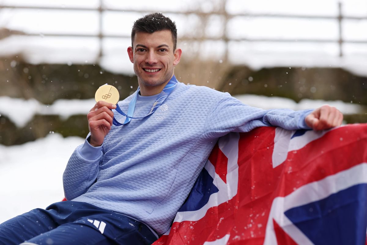 Matt Weston posing with his first gold medal at the Milano Cortina Games