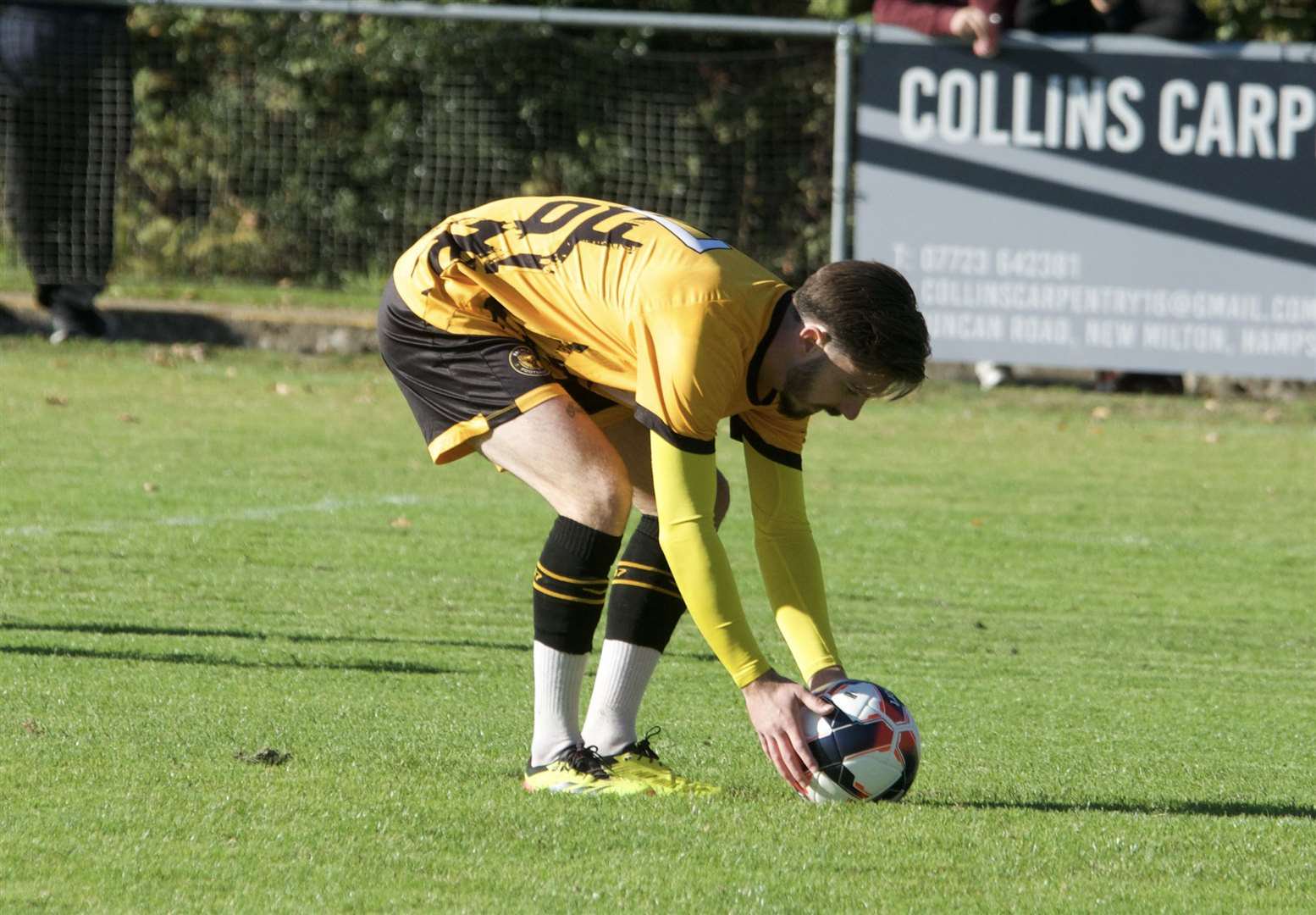 Luke Delaney places the ball down before scoring from the penalty spot against Horndean (Photo: Bashley)