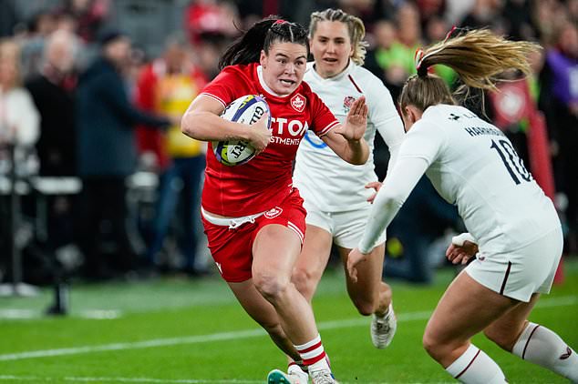 England's Zoe Harrison (10) moves to tackle Canada's Alysha Corrigan,left, who runs with the ball during the first half of a women's rugby match in Toronto, Friday, Oct. 16, 2026. (Arlyn McAdorey/The Canadian Press via AP)