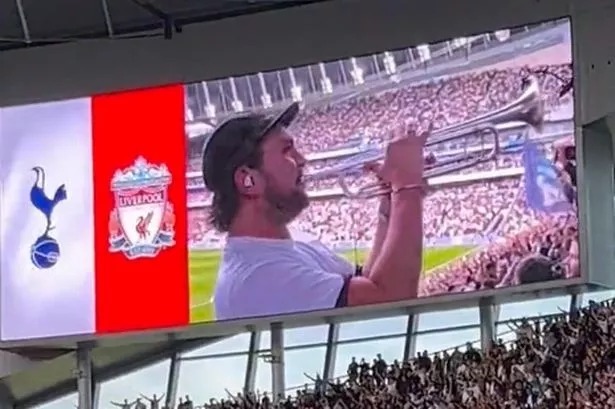 A trumpeter entertaining the fans ahead of Tottenham's clash with Liverpool