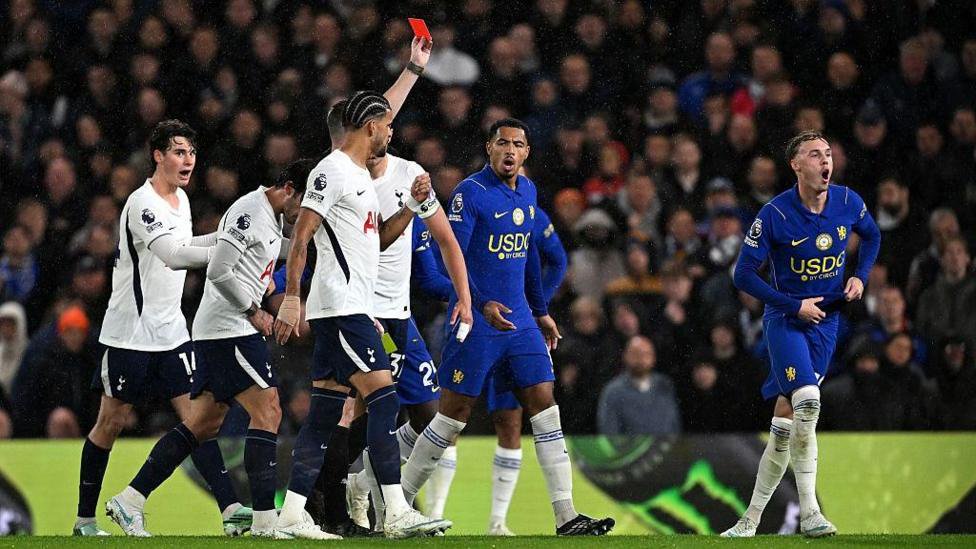 Cole Palmer is shown a red card